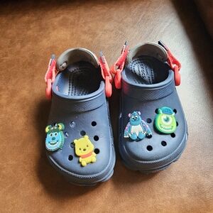 CROCS Kids Navy Clogs with Bright Red Heel Straps and Character Charms